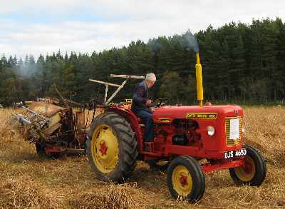 Traditional binder and modern tractor - photo 1