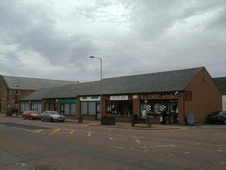 Zoom in Forbes, Jewellers, and The Pet Shop, High Street, Invergordon.