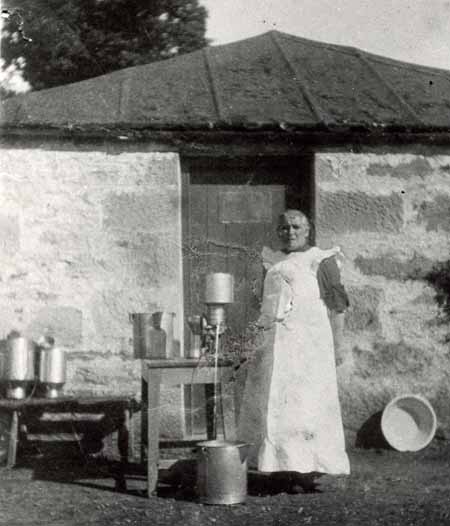 Mrs Isabella Maclean beside the first milk separator to be introduced to Ross-shire