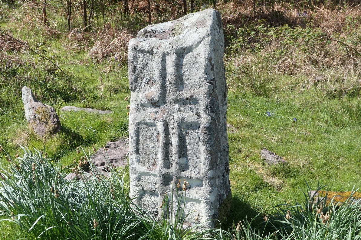 A cross slab within the burial ground