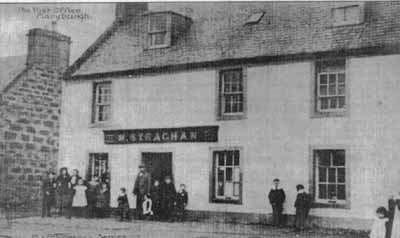 Photograph of the Post Office and Shop at Maryburgh owned by the Strachan family and taken after the year 1900. The photograph is taken from a postcard published by Macpherson Brothers of Beauly and Invergordon.