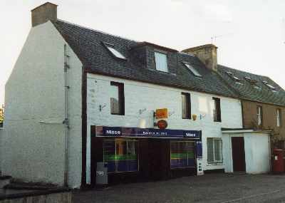 Zoom in Maryburgh shop showing Post Office sign but this facility ceased in July 2008.