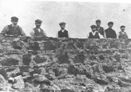 Zoom in Workmen re-building Dunskaith House, c1906