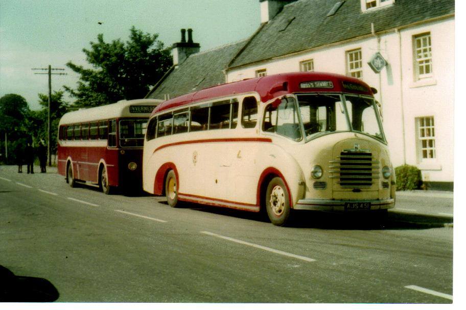 Johnnie Ross's red and cream bus parked outside Conon Hotel with a Highland Omnibuses vehicle behind. Johnnie Ross's red and cream bus parked outside Conon Hotel with a Highland Omnibuses vehicle behind.