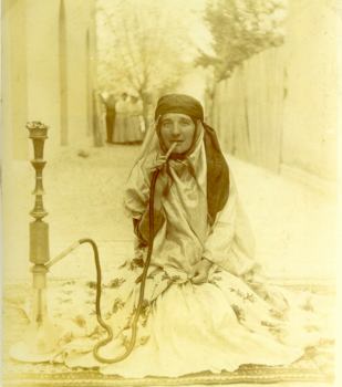 Zoom in Dr. Elizabeth Ness MacBean Ross dressed as a Baktari Tribal Chief