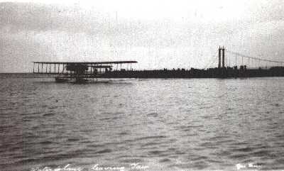 Zoom in 1914 - Royal Navy Air Service seaplane taking off from Tain River.