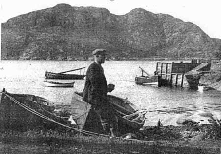 Zoom in At Diabaig pier is Alexander (Alla) Cameron