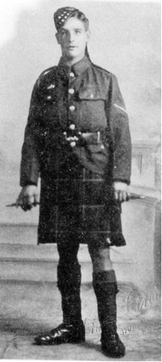 Zoom in Sergeant John Meikle, standing wearing uniform