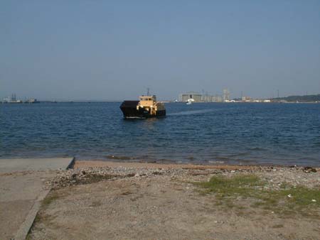Zoom in The former Cromarty-Nigg ferry approaching the slipway at Cromarty.