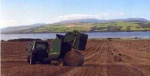 Dropping off a round bale
