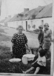 Donnie Wilson and Alistair Munro watching Markie salting and gutting herring.