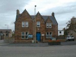 Police Station, at the west end of High Street.