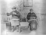 Two people baiting fishing lines