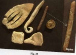 Fig 29 - More lead finds include beads, writing tools (styli), weights (round and square), a spoon-like object, lead peg and lead decoration of some kind