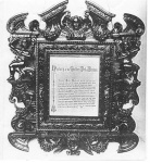 Plaque beside the golden bed.
