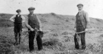 l-r: Mrs Thom's Uncle Donny, Danny Macleod, Big Hughie in ground rented from Pitcalzean Estate at the back of Broomhill known as the 'the park' which was crofted by Danny Macleod. c.1920s.