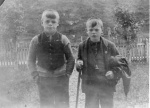 James and John Ross in garden at Lower Bayfield before going off to collect cows, c. late 1920's.