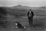 Alec John and his dog with Ben Wyvis in the background