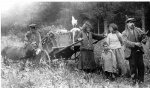 Travelling people with donkey.