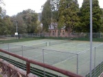The tennis courts beside the Pavilion with St Anne's Church in the background.