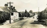 Progress on Conon high street with cars instead of horse and cart.